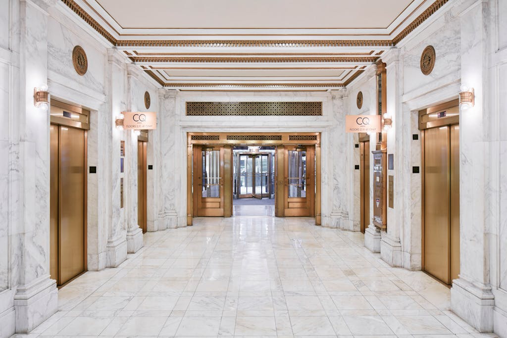 Marble lobby leading to the elevators at Club Quarters Hotel, Wacker at Michigan, Chicago