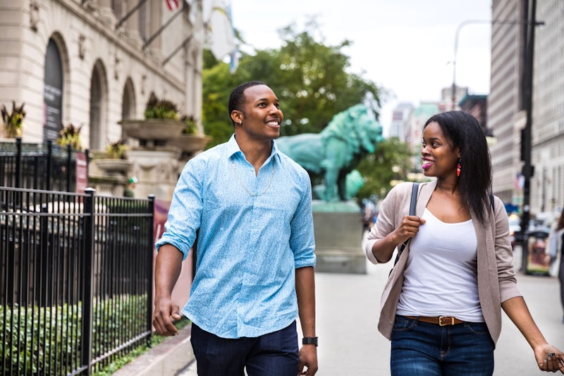 Couple walking down street in Chicago