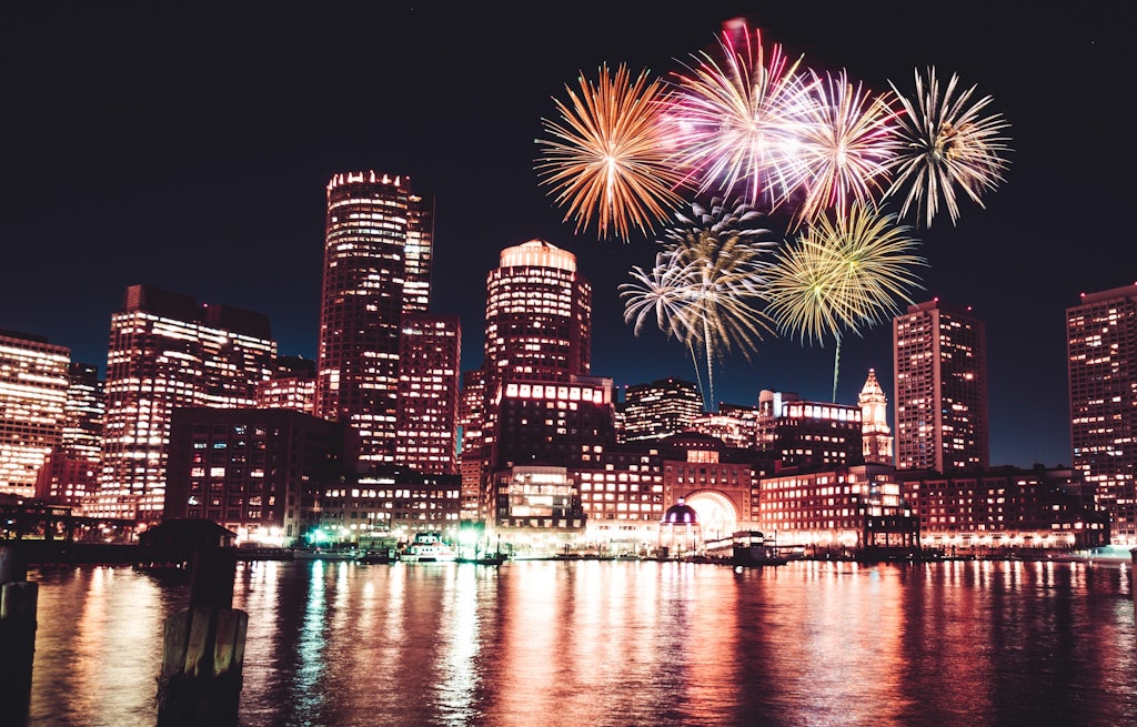 boston skyline at night with fireworks
